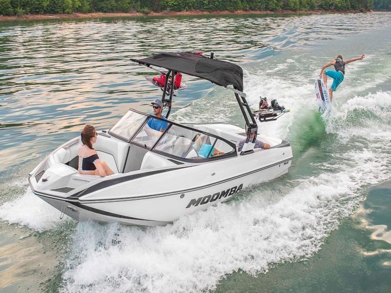 2021 Moomba Mojo with wakeboarder in tow on a lake